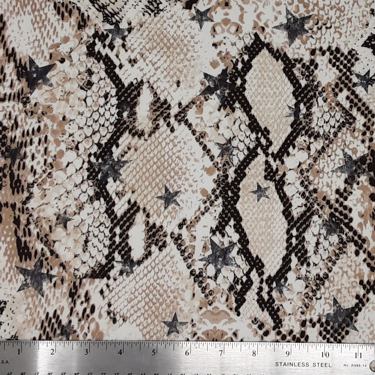 BEIGE/BROWN DTY BRUSHED PRINT SNAKE/STARS FOIL PRINT